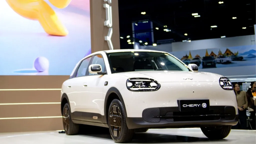 A white Chery electric vehicle on display at an auto show exhibition, highlighting modern design from the Best EV brands.