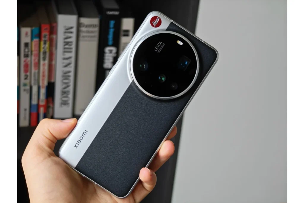 Xiaomi 16 Ultra in silver and black leather finish showing Leica quad-camera circular module